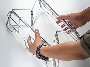Remove the stand and hold both sides to open it.