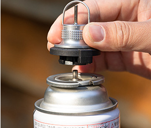 Insert the adapter into a compatible cassette gas canister and rotate approximately 45° until securely locked.
